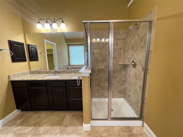 bathroom with an enclosed shower and vanity