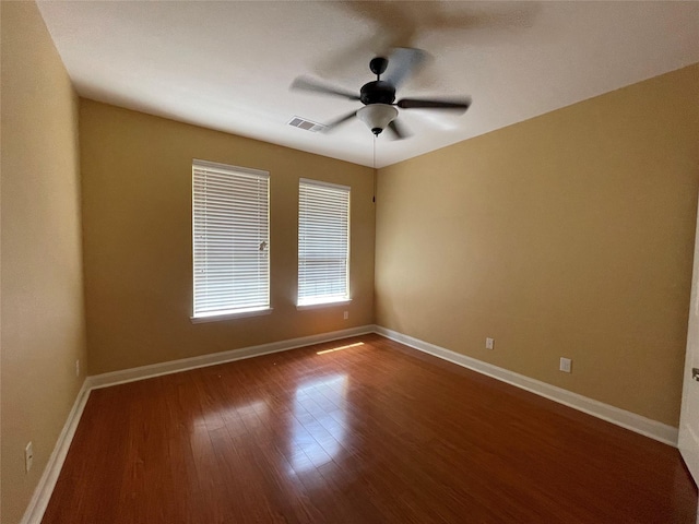 unfurnished room with hardwood / wood-style flooring and ceiling fan