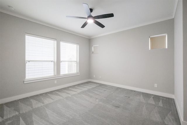 unfurnished room featuring ceiling fan, crown molding, and carpet floors