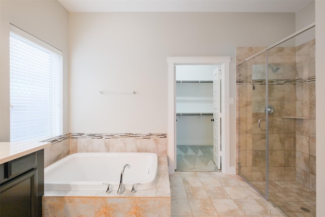 bathroom with separate shower and tub