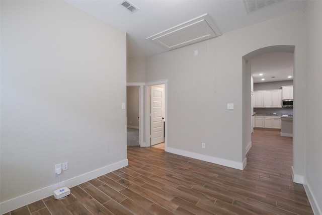 spare room with dark hardwood / wood-style flooring