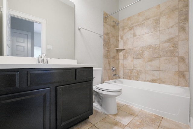 full bathroom featuring vanity, toilet, tile patterned floors, and tiled shower / bath combo