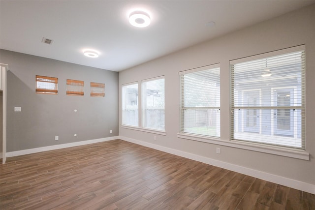 spare room featuring hardwood / wood-style floors