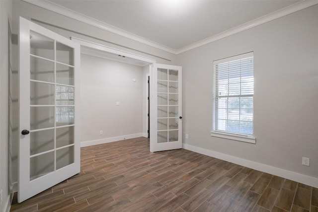 spare room featuring ornamental molding and french doors