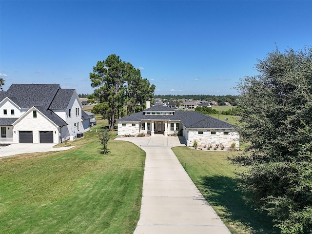 view of front of property with a garage and a front yard