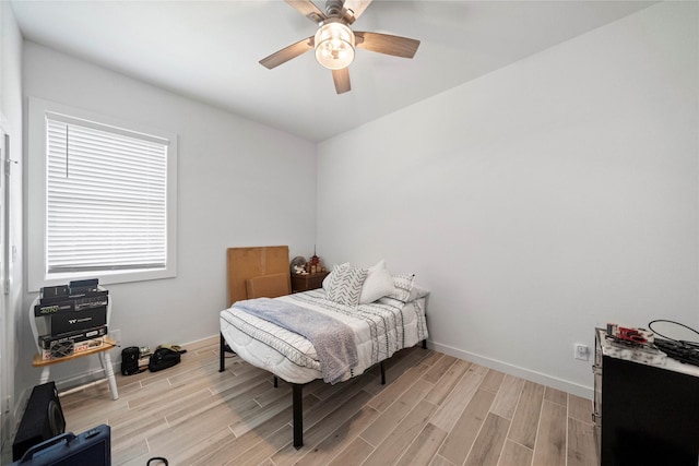 bedroom featuring light wood-type flooring and ceiling fan