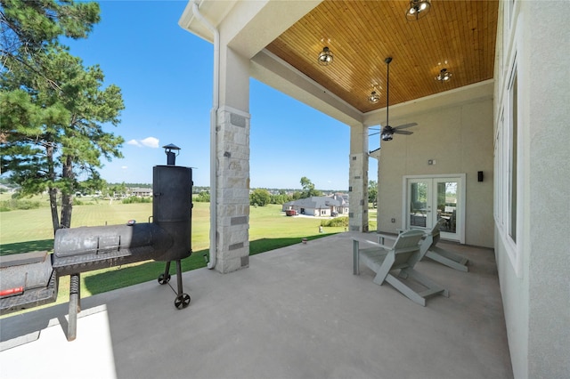 view of patio featuring ceiling fan and french doors