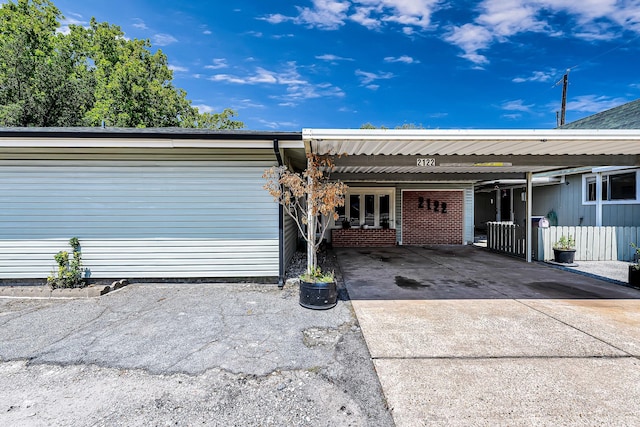 entrance to property featuring a carport