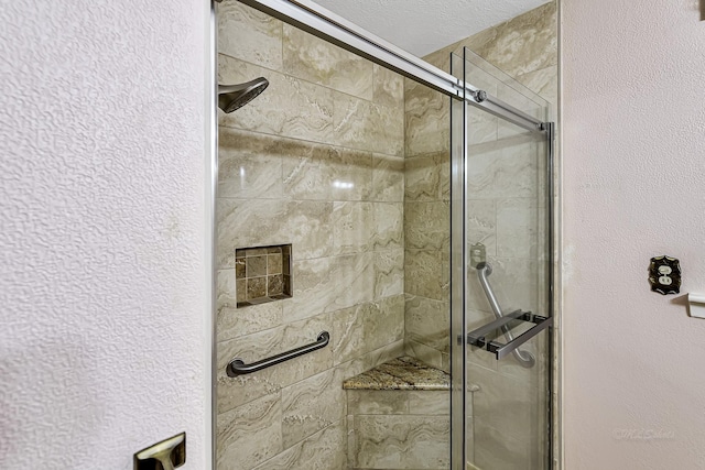 bathroom with a shower with shower door