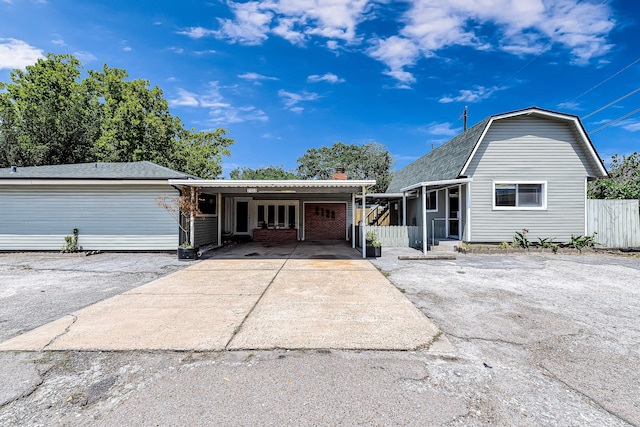 view of front of property featuring a carport