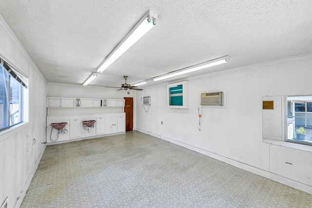 garage featuring a wall mounted air conditioner