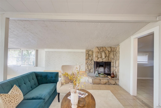 tiled living room with lofted ceiling and a fireplace