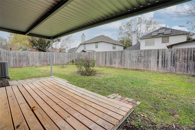 exterior space with a yard and central AC unit