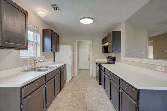 kitchen with stainless steel dishwasher, sink, dark brown cabinets, black electric range, and light tile patterned flooring