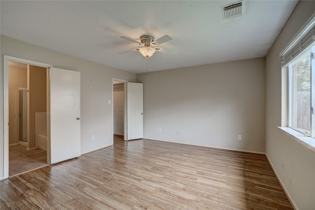 unfurnished room featuring light hardwood / wood-style floors and ceiling fan