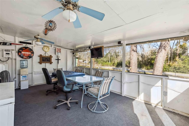 sunroom / solarium featuring ceiling fan