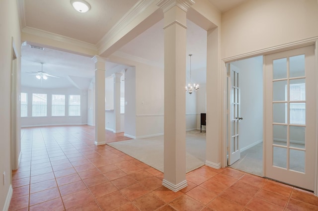 interior space featuring light colored carpet, ornamental molding, and ornate columns