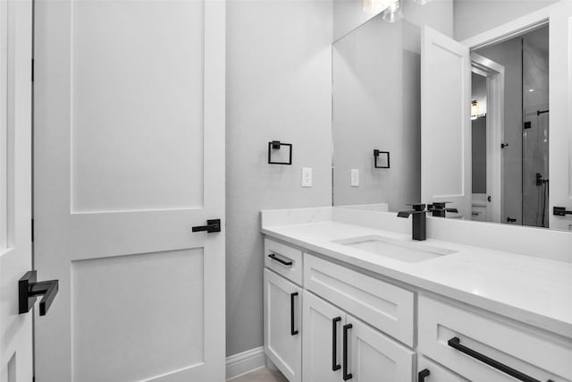 bathroom with a shower and vanity