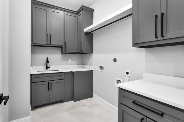 laundry room featuring cabinets, hookup for an electric dryer, sink, and hookup for a washing machine