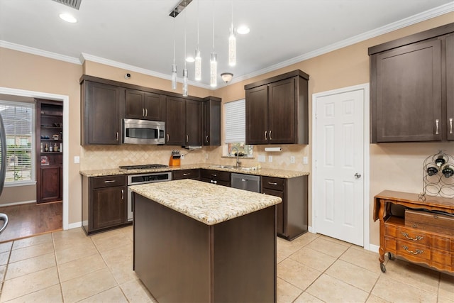 kitchen with dark brown cabinets, light tile patterned flooring, stainless steel appliances, and a kitchen island