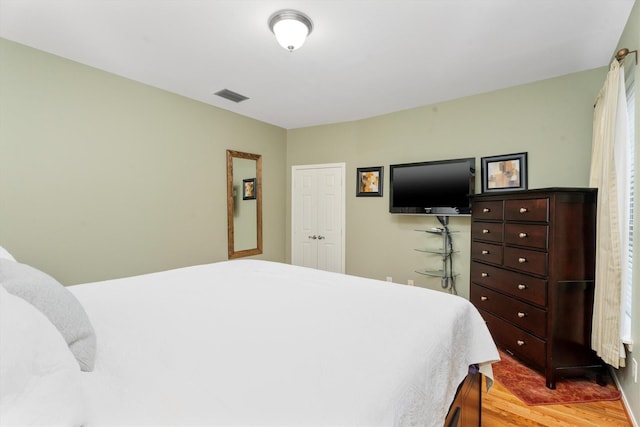 bedroom with light hardwood / wood-style flooring