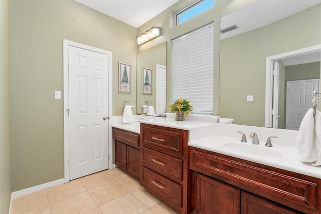 bathroom with vanity and tile patterned floors