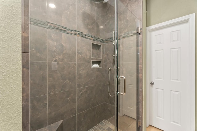 bathroom with an enclosed shower