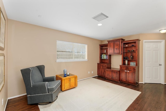 living area with dark hardwood / wood-style floors