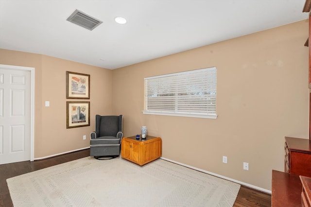 sitting room featuring dark hardwood / wood-style floors