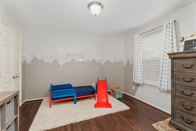 game room with dark hardwood / wood-style flooring