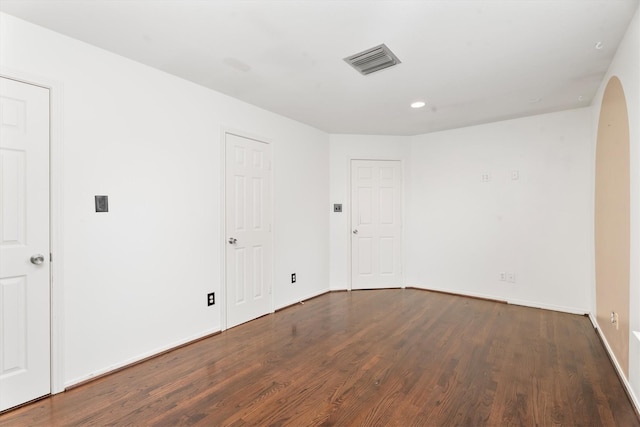 unfurnished room featuring dark hardwood / wood-style flooring