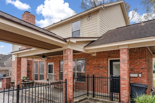 back of property with ceiling fan