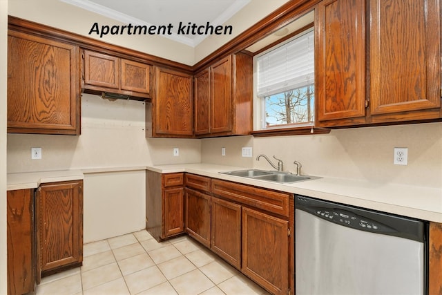 kitchen with sink, light tile patterned floors, ornamental molding, and dishwasher