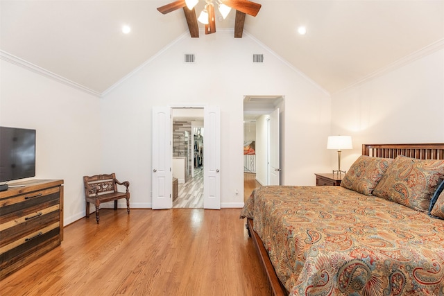 bedroom featuring ceiling fan, light hardwood / wood-style flooring, lofted ceiling with beams, and ornamental molding