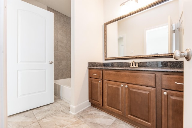 bathroom with vanity and bathtub / shower combination