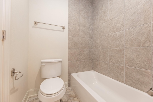 bathroom featuring toilet and shower / washtub combination