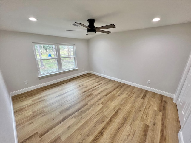 empty room featuring light hardwood / wood-style flooring and ceiling fan