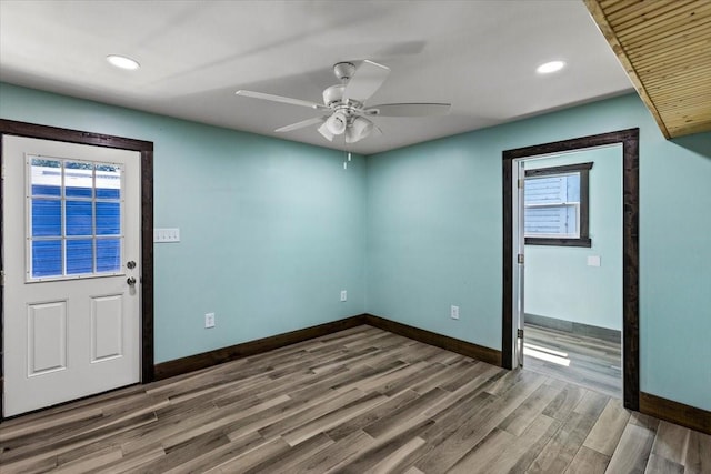 empty room featuring hardwood / wood-style flooring and ceiling fan