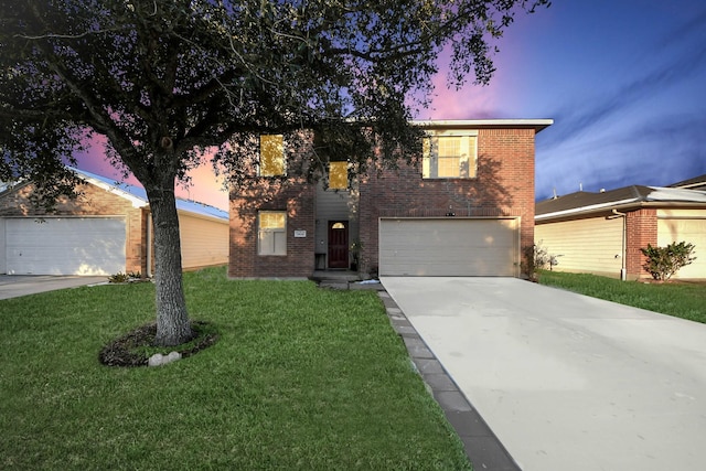 view of front property with a garage and a lawn