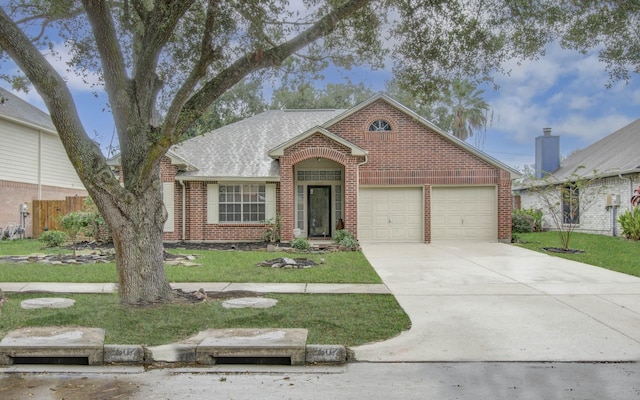 view of front of property with a garage and a front yard