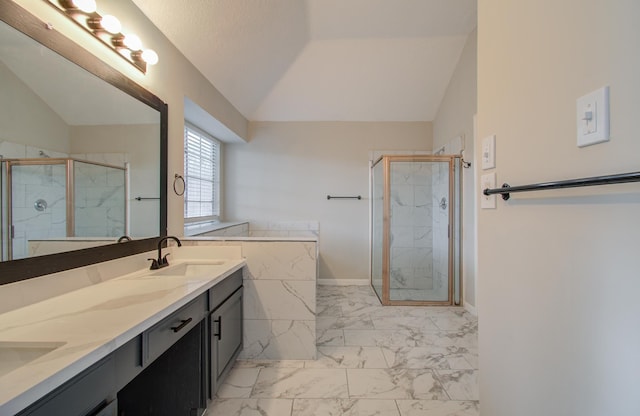 bathroom featuring a shower with door, lofted ceiling, and vanity