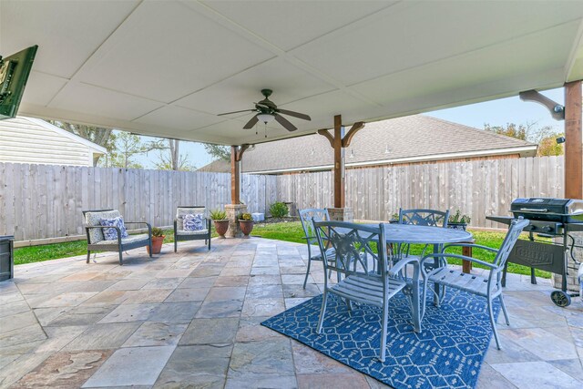 view of patio featuring ceiling fan