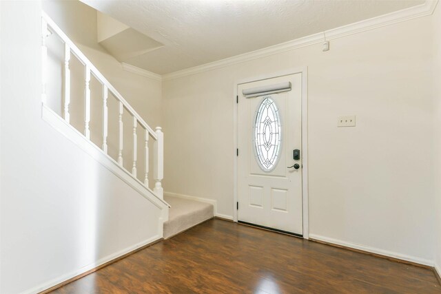 entrance foyer featuring crown molding and dark wood-type flooring