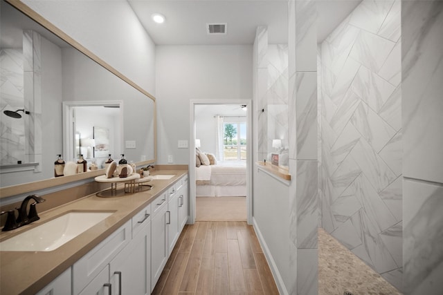 full bath with visible vents, a sink, ensuite bath, and a walk in shower