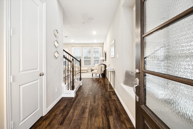 corridor with dark wood-type flooring