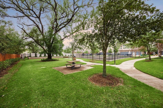 view of property's community featuring a yard