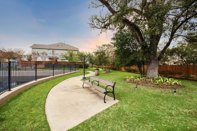 surrounding community featuring a patio area and a lawn