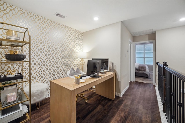 home office with dark hardwood / wood-style flooring