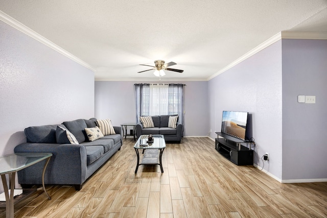 living room featuring ceiling fan, ornamental molding, light hardwood / wood-style floors, and a textured ceiling