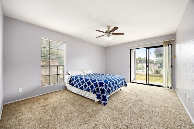 bedroom with ceiling fan, carpet, and access to exterior